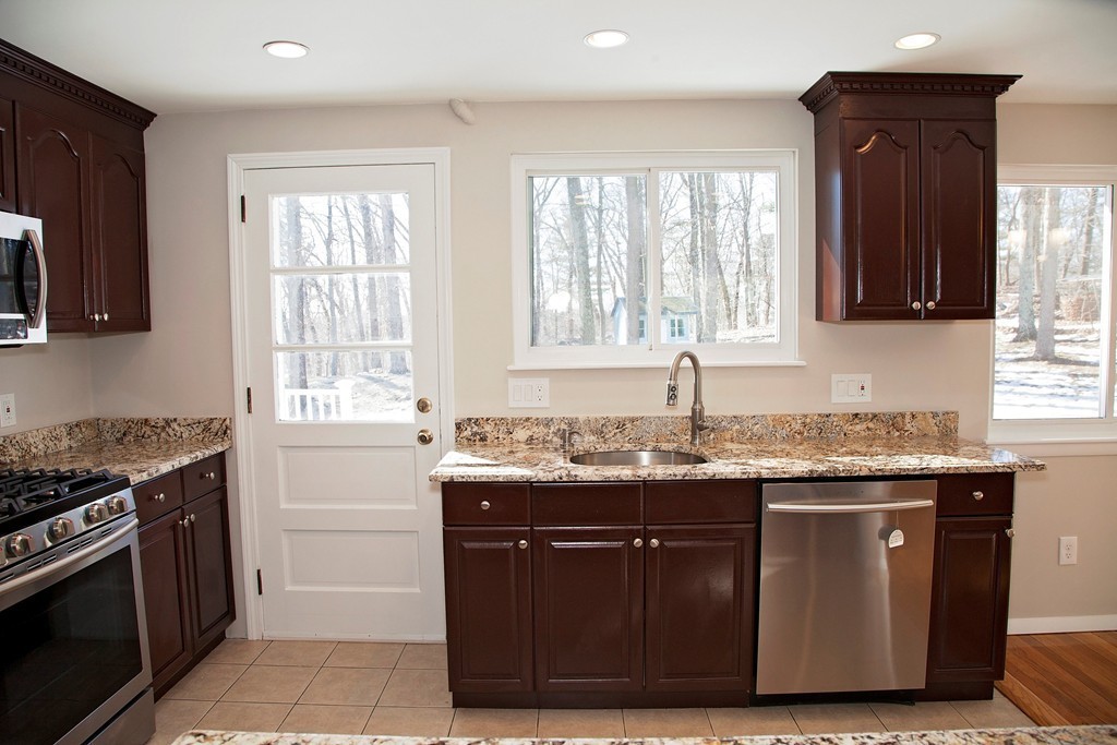 14 McAdams Road Framingham, MA 01701 - Photo 8 of 15 a kitchen with granite countertop a sink and a stove