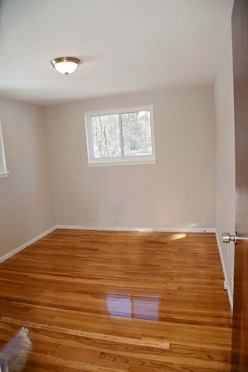 14 McAdams Road Framingham, MA 01701 - Photo 9 of 15 a view of empty room with wooden floor