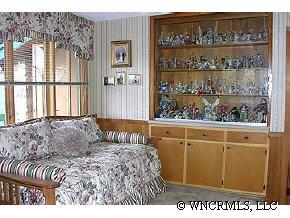 544 Brown Ridge Road Maggie Valley, NC 28751 - Photo 10 of 12 a bed sitting in a bedroom next to a window