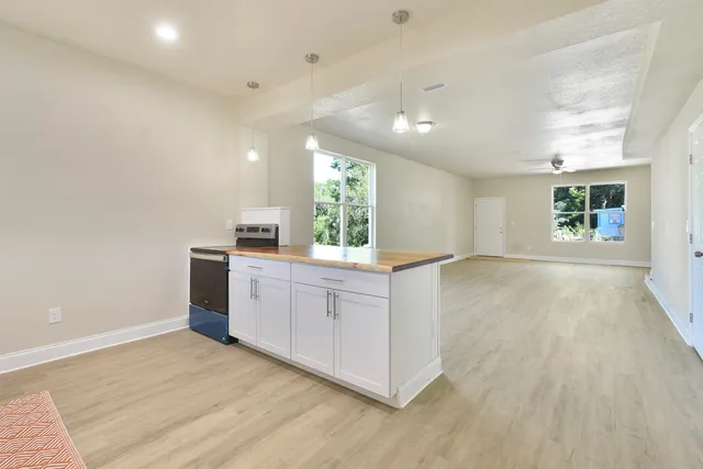 a kitchen with a stove and a microwave