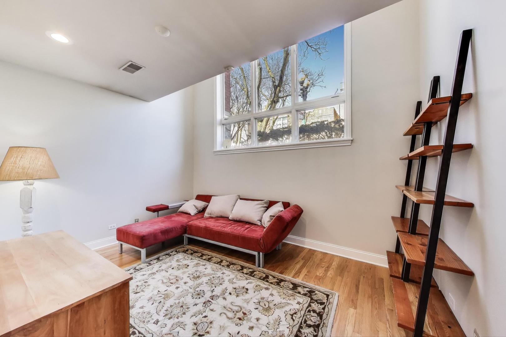 1035 West Taylor Street, Unit 1 Chicago, IL 60607 - Photo 13 of 22 a living room with furniture and a wooden floor