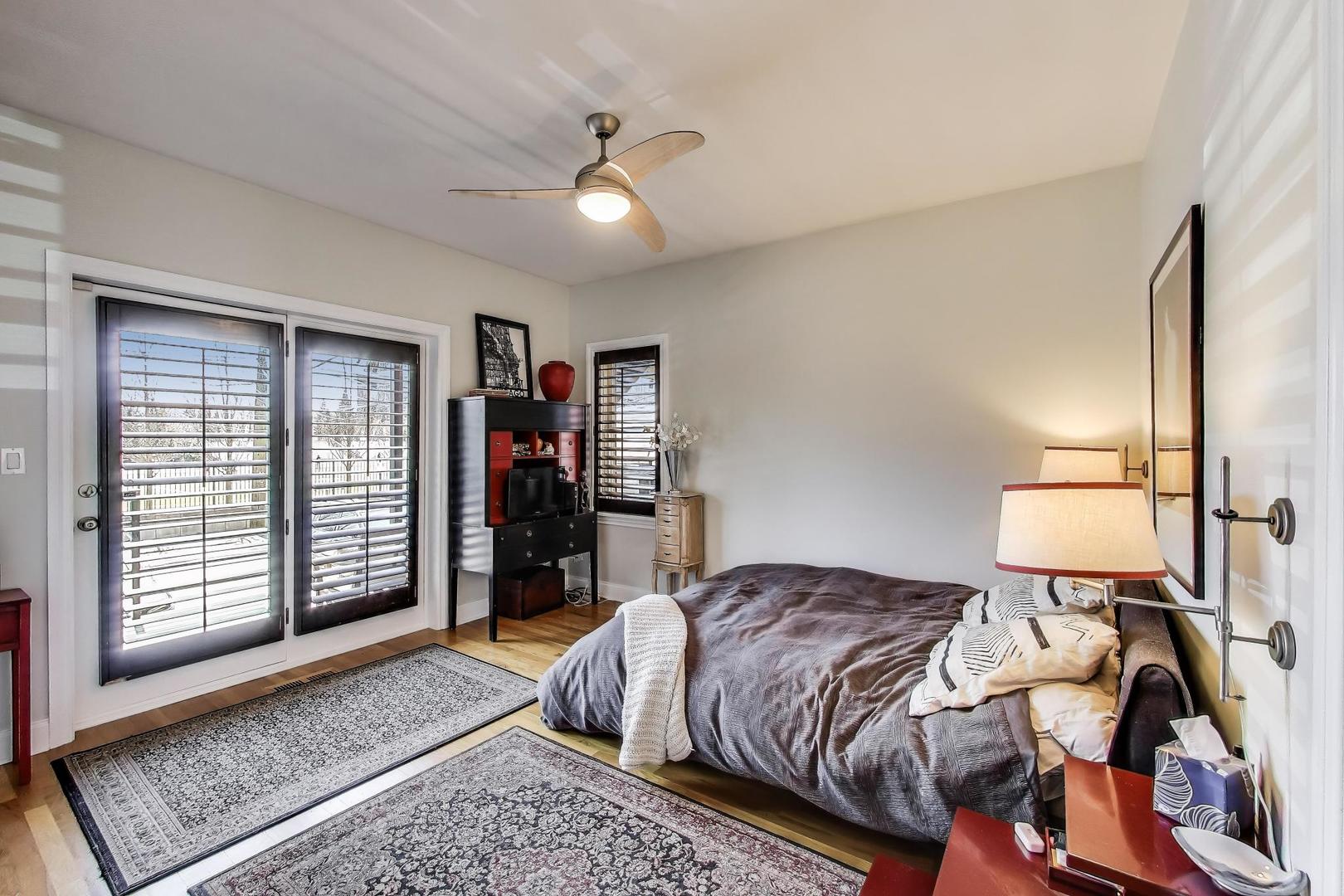 1035 West Taylor Street, Unit 1 Chicago, IL 60607 - Photo 7 of 22 a bedroom with a large bed and a window