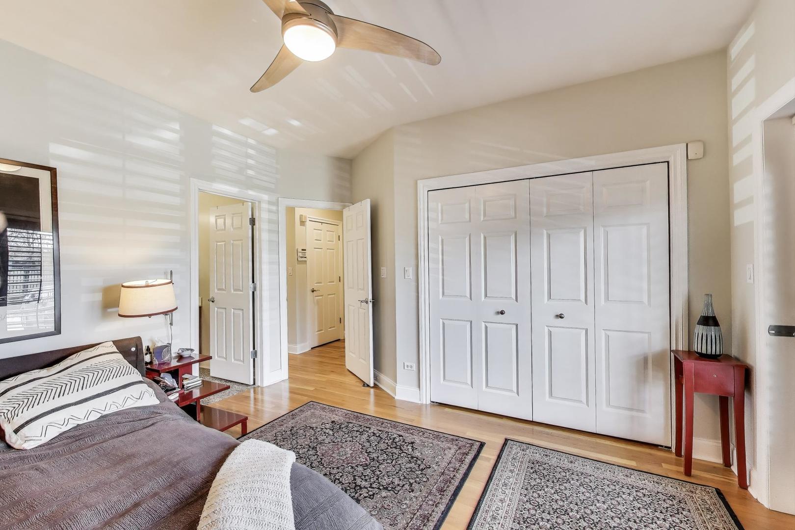 1035 West Taylor Street, Unit 1 Chicago, IL 60607 - Photo 8 of 22 a bed room with a bed and a window
