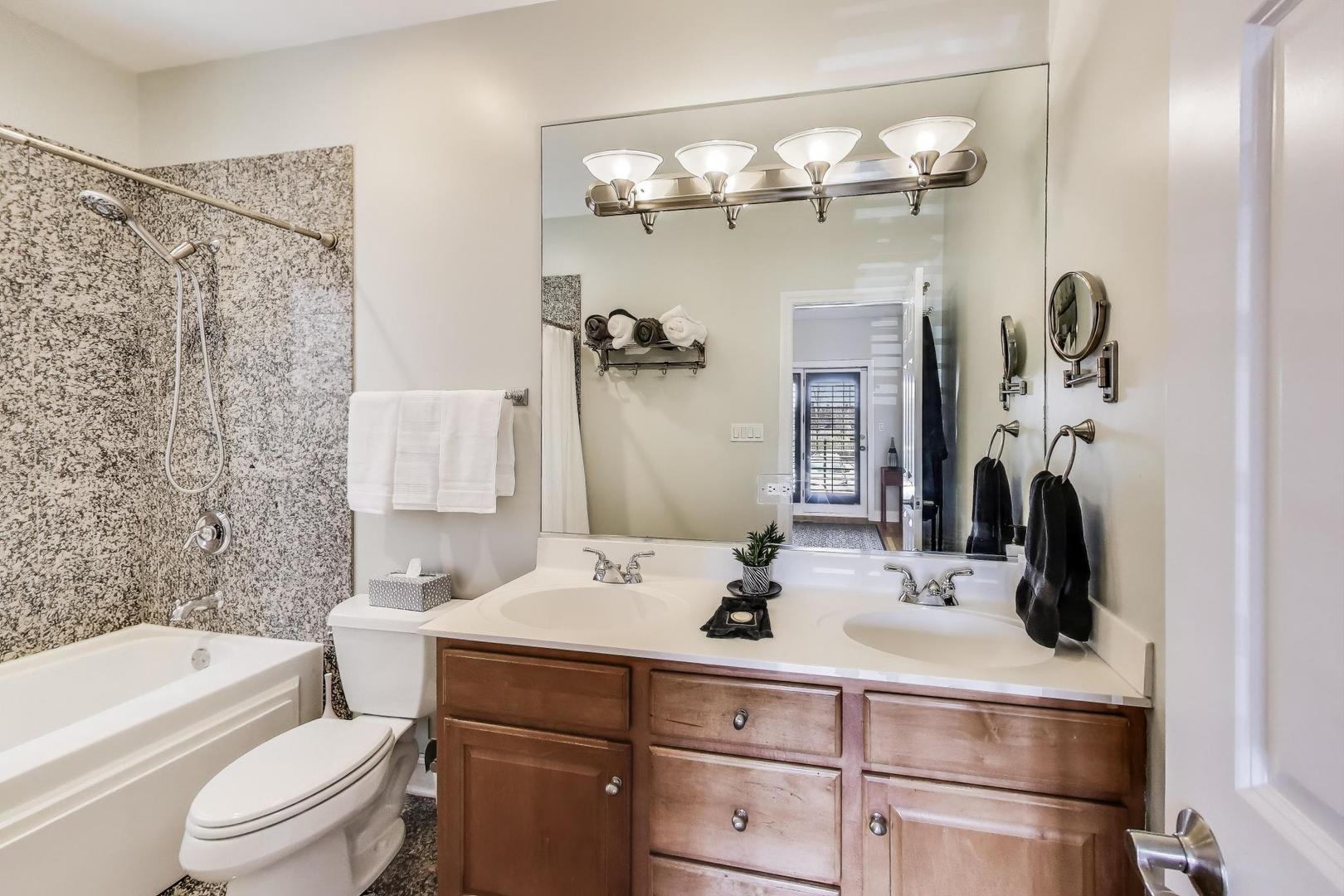 1035 West Taylor Street, Unit 1 Chicago, IL 60607 - Photo 10 of 22 a bathroom with a sink a toilet and shower