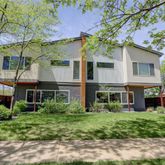 front view of a house with a garden