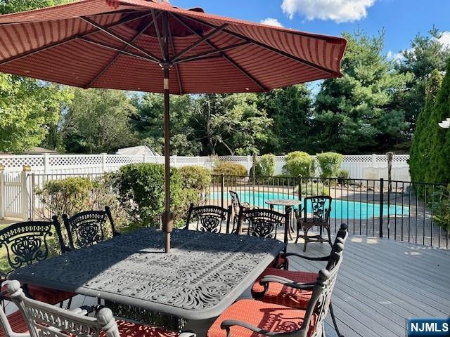 38 Totowa Road Wayne, NJ 07470 - Photo 12 of 29 a view of a patio with a table and chairs under an umbrella