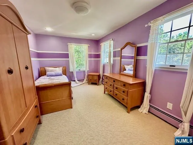 a bedroom with furniture and window