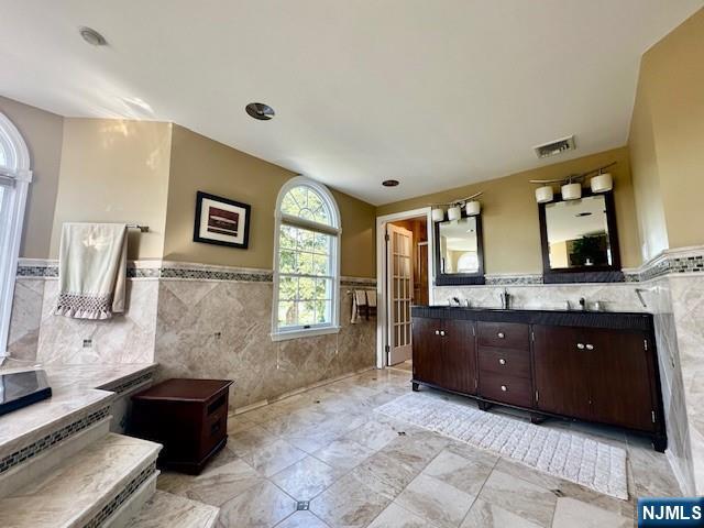 38 Totowa Road Wayne, NJ 07470 - Photo 17 of 29 a spacious bathroom with a tub sink and mirror