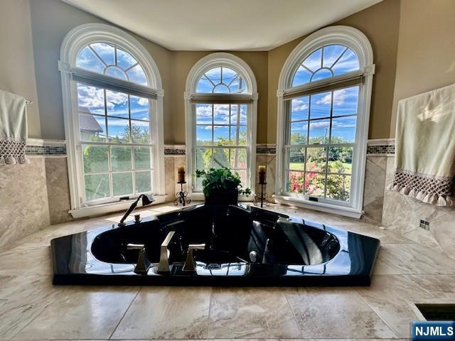 38 Totowa Road Wayne, NJ 07470 - Photo 18 of 29 a living room with large windows and a chandelier