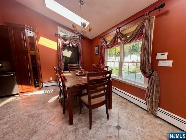 a dining room with furniture and window