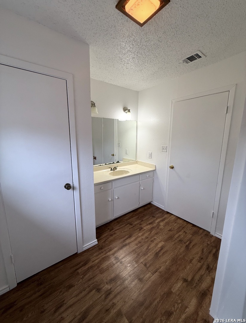 106 Adkins Road Refugio, TX 78377 - Photo 10 of 11 a view of a bathroom with double vanity sink and a mirror