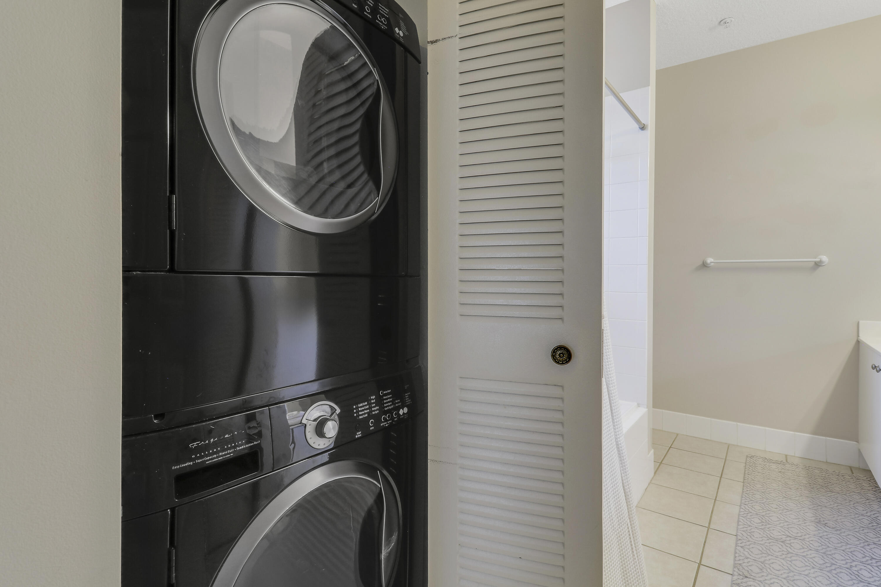 1152 University Boulevard, Unit 22 Jupiter, FL 33458 - Photo 23 of 24 a close view of utility and utility room with washer and dryer