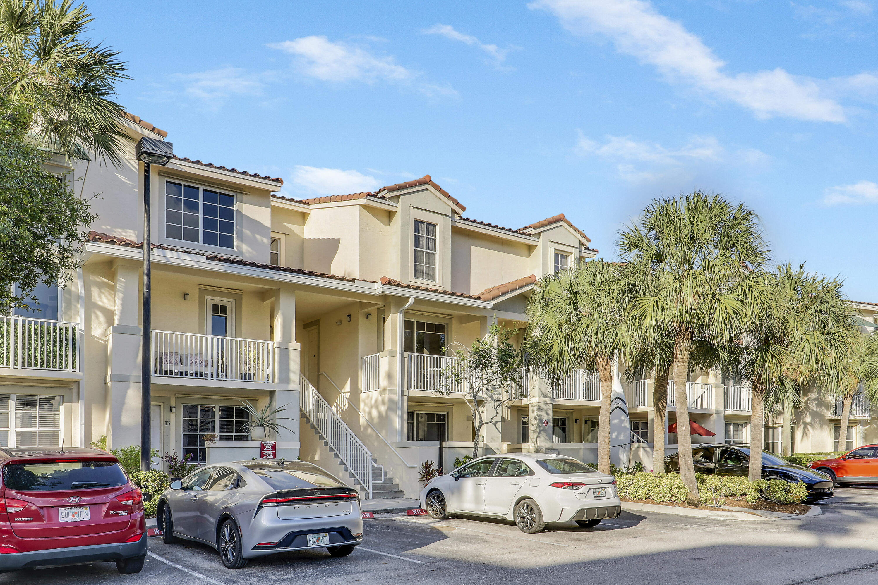 1152 University Boulevard, Unit 22 Jupiter, FL 33458 - Photo 24 of 24 a car parked in front of a building