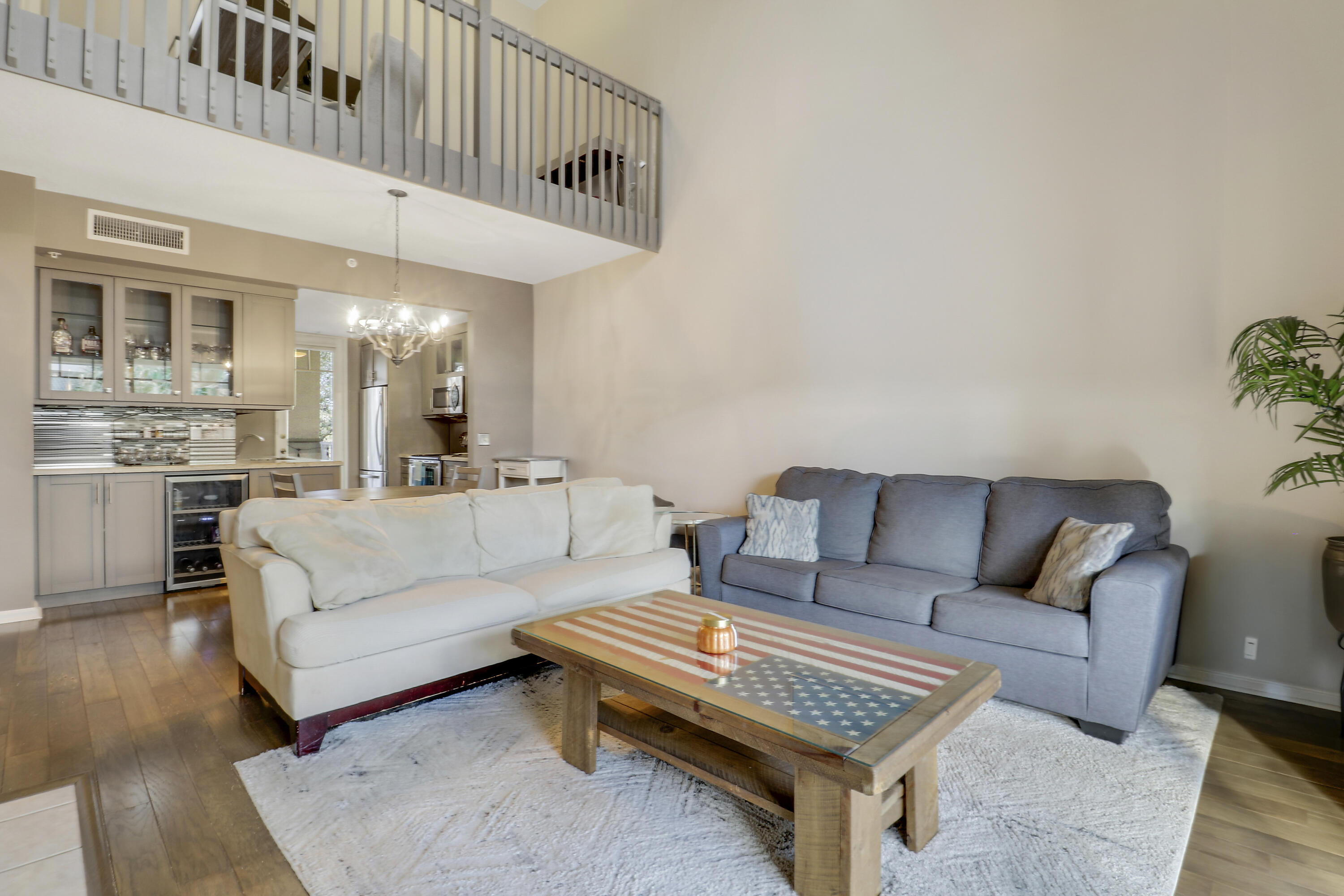 1152 University Boulevard, Unit 22 Jupiter, FL 33458 - Photo 4 of 24 a living room with furniture and a rug