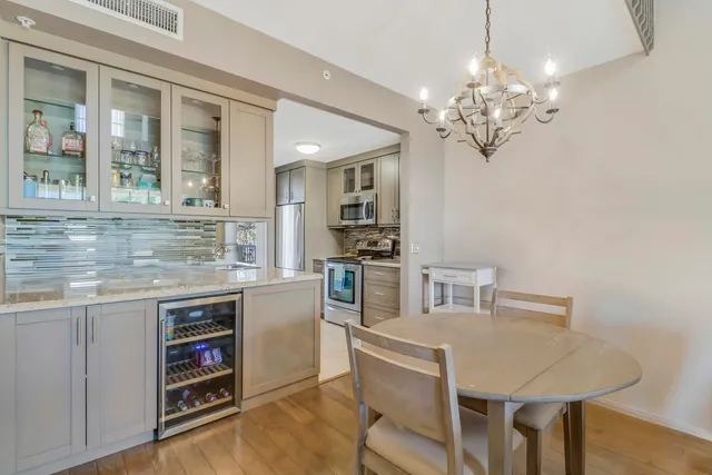 a kitchen with a table and chairs in it
