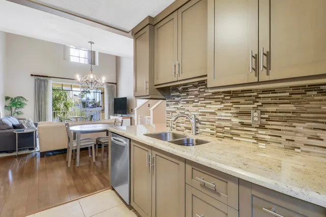a kitchen with a sink and cabinets