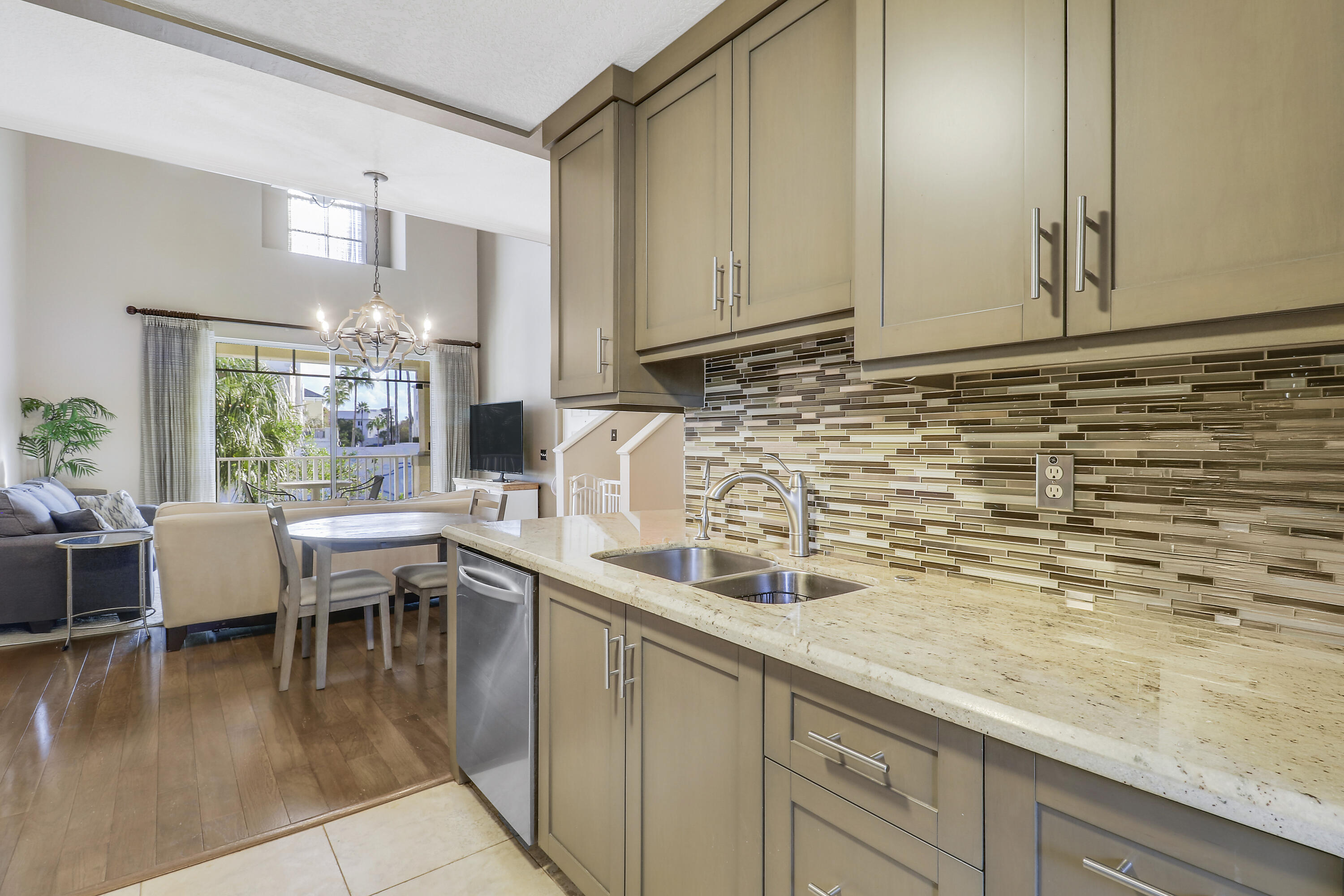 1152 University Boulevard, Unit 22 Jupiter, FL 33458 - Photo 9 of 24 a kitchen with a sink and cabinets