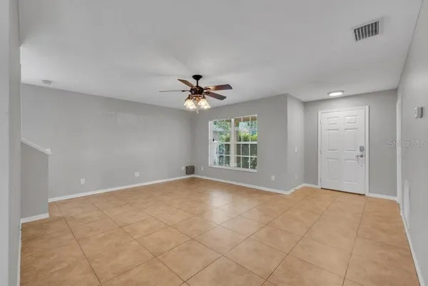 a view of an empty room with a window