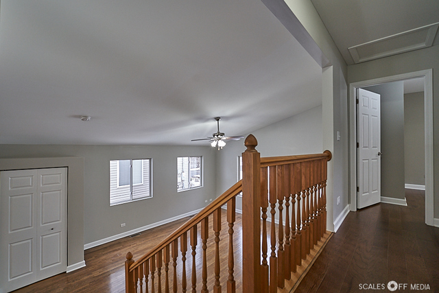 36692 North Stanton Point Road Ingleside, IL 60041 - Photo 14 of 29 a view of a hallway with wooden floor and staircase