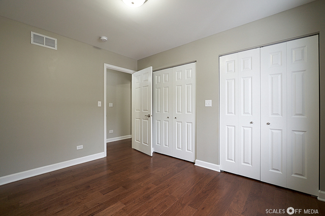 36692 North Stanton Point Road Ingleside, IL 60041 - Photo 22 of 29 a view of an empty room with wooden floor