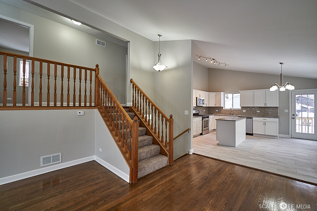 36692 North Stanton Point Road Ingleside, IL 60041 - Photo 4 of 29 a view of a kitchen with wooden floor and electronic appliances