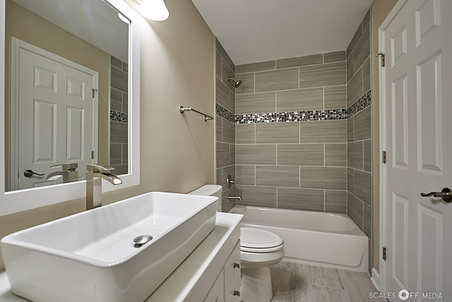 36692 North Stanton Point Road Ingleside, IL 60041 - Photo 5 of 29 a bathroom with a sink a toilet and shower