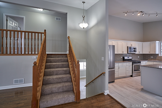 36692 North Stanton Point Road Ingleside, IL 60041 - Photo 8 of 29 a view of a kitchen with cabinets and wooden floor