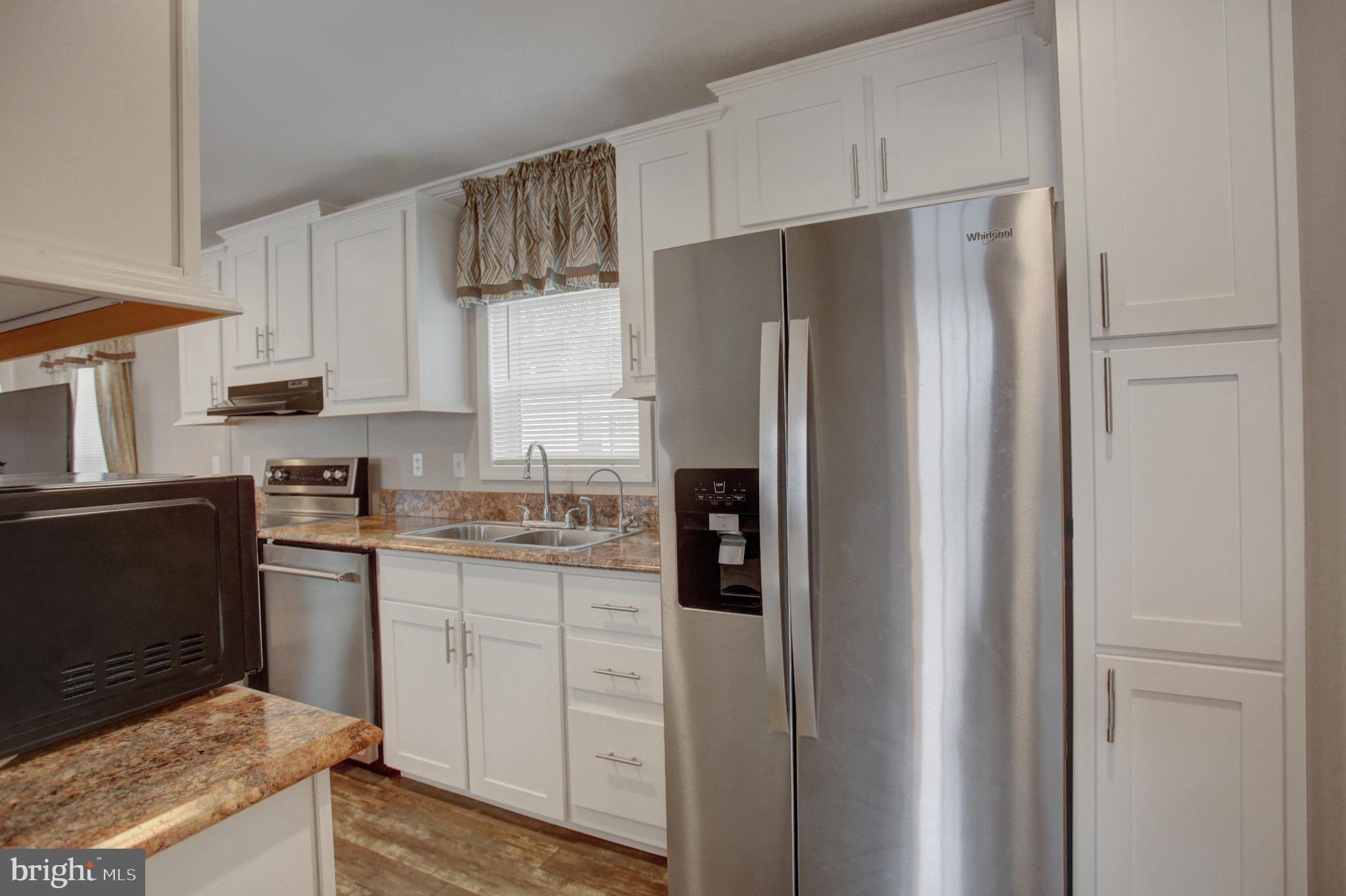 113 Big Spring Terrace Newville, PA 17241 - Photo 12 of 37 a kitchen with stainless steel appliances granite countertop a refrigerator and a stove top oven
