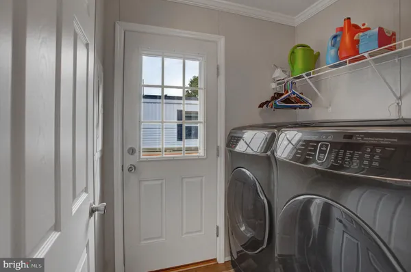 a view of storage and utility room with washer and dryer