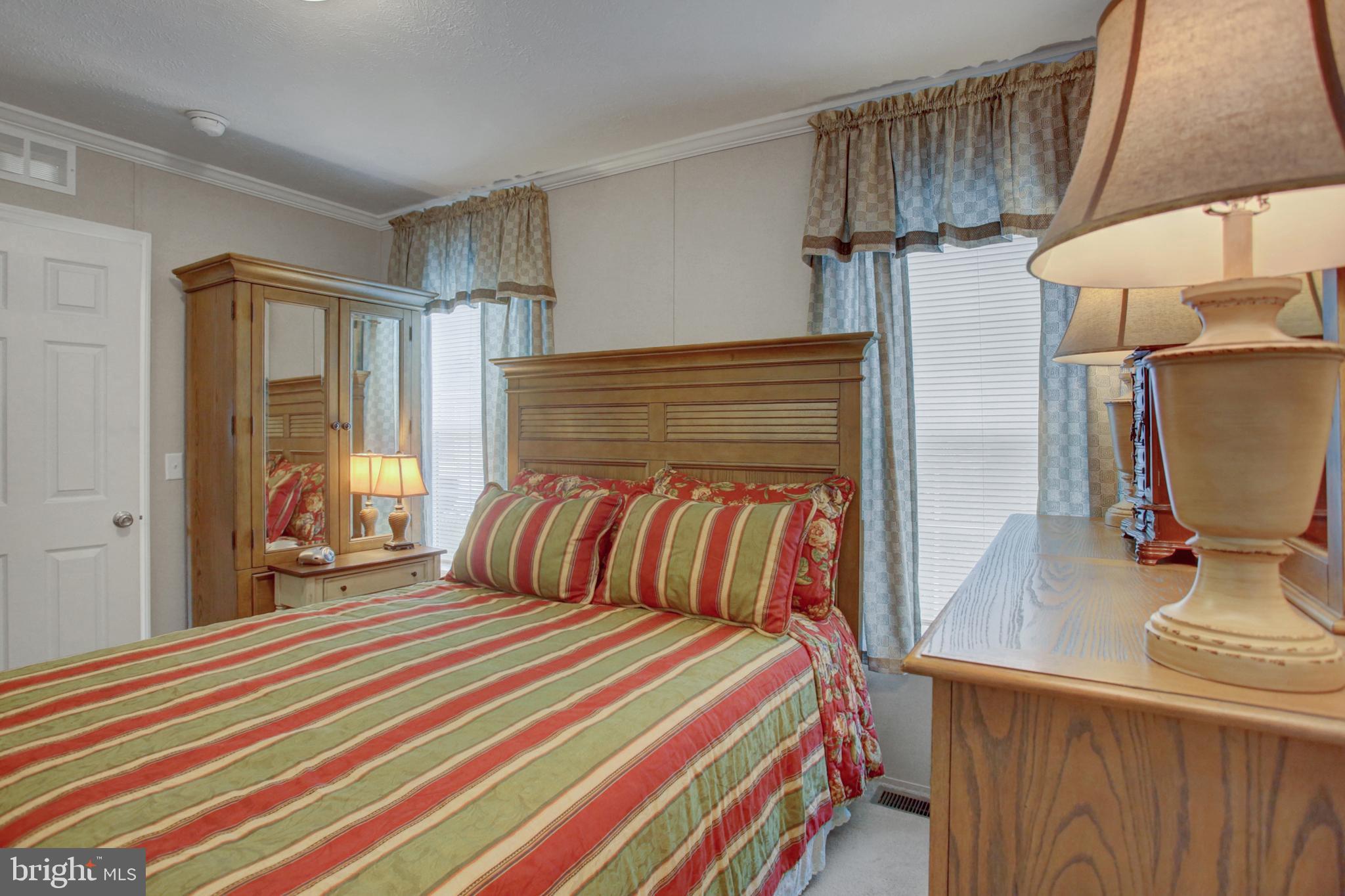 113 Big Spring Terrace Newville, PA 17241 - Photo 18 of 37 a bedroom with a bed and a flat tv screen on dresser