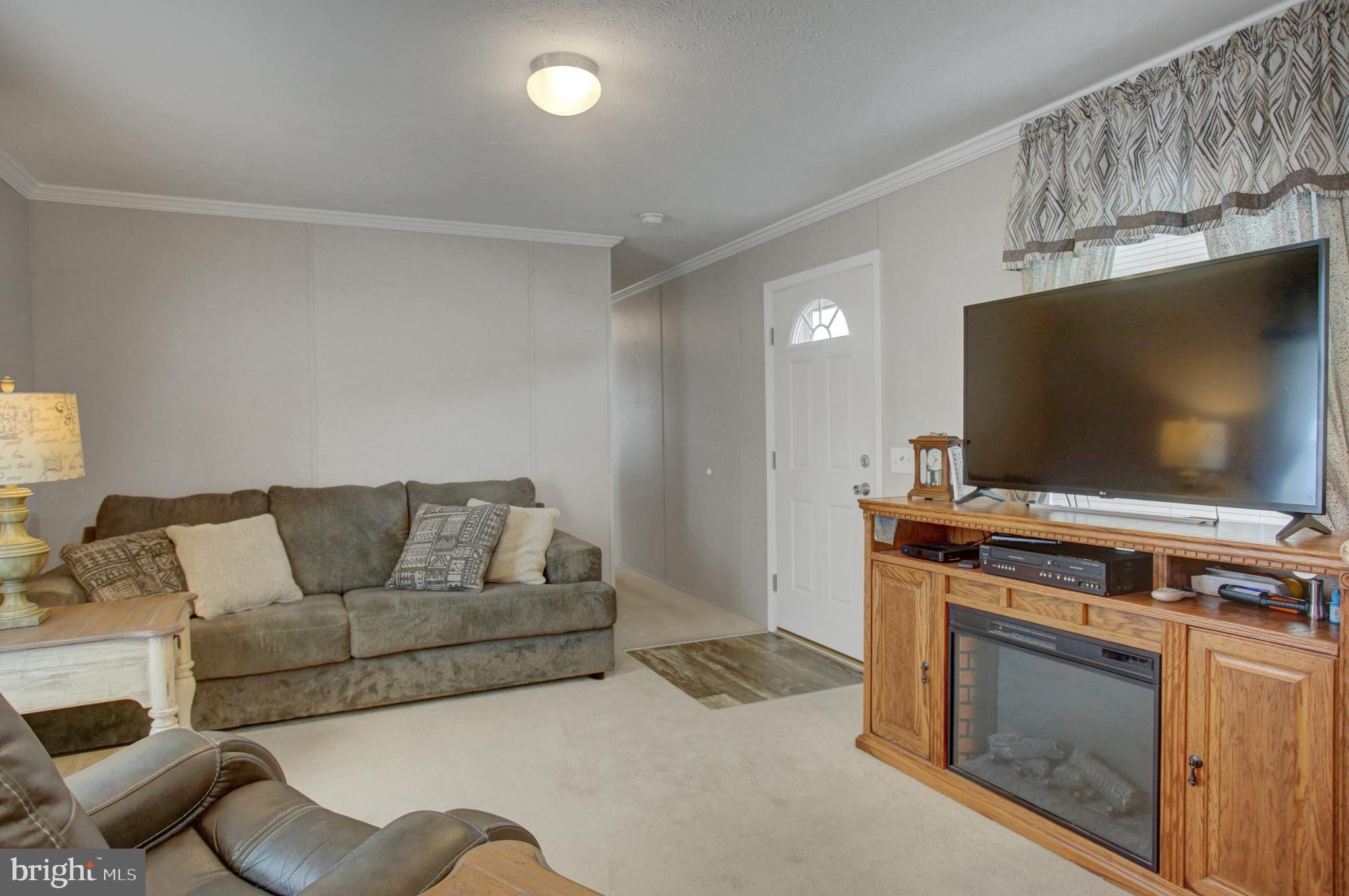 113 Big Spring Terrace Newville, PA 17241 - Photo 3 of 37 a living room with furniture and a flat screen tv