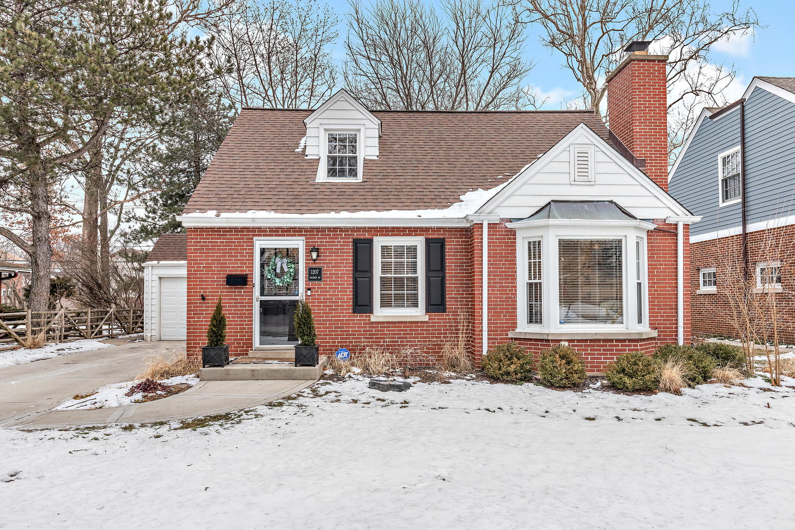 1207 Raleigh Road Glenview, IL 60025 - Photo 1 of 31 a front view of a house with a yard