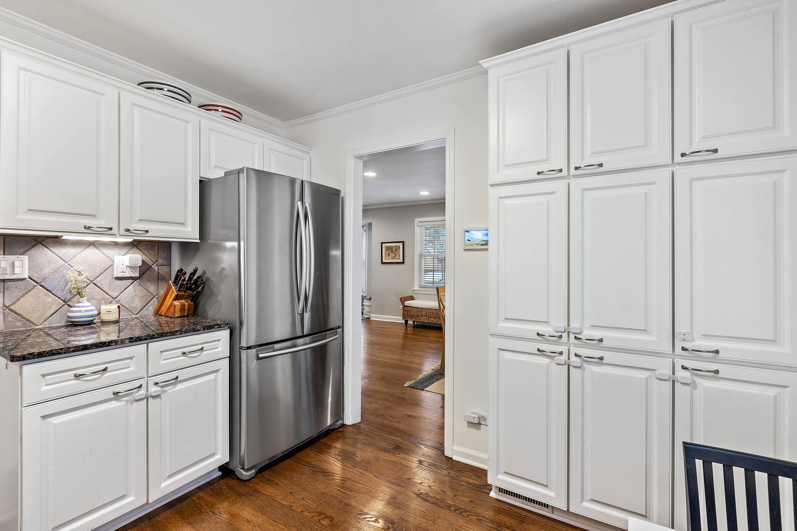 1207 Raleigh Road Glenview, IL 60025 - Photo 13 of 31 a kitchen with granite countertop stainless steel appliances a refrigerator and cabinets