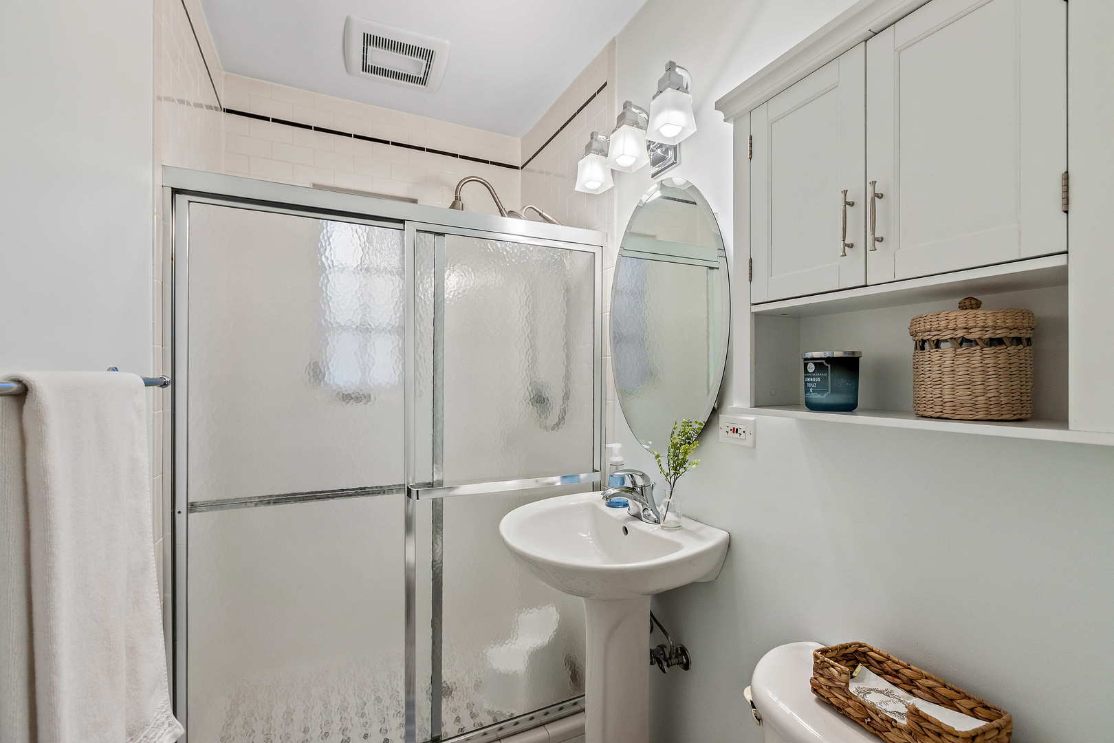 1207 Raleigh Road Glenview, IL 60025 - Photo 16 of 31 a bathroom with a sink shower and a mirror