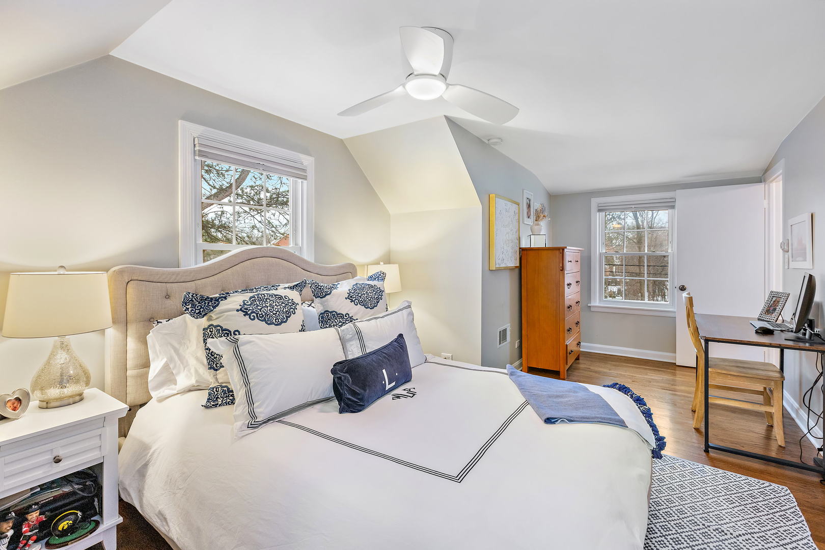1207 Raleigh Road Glenview, IL 60025 - Photo 20 of 31 a bedroom with a bed and wooden floor