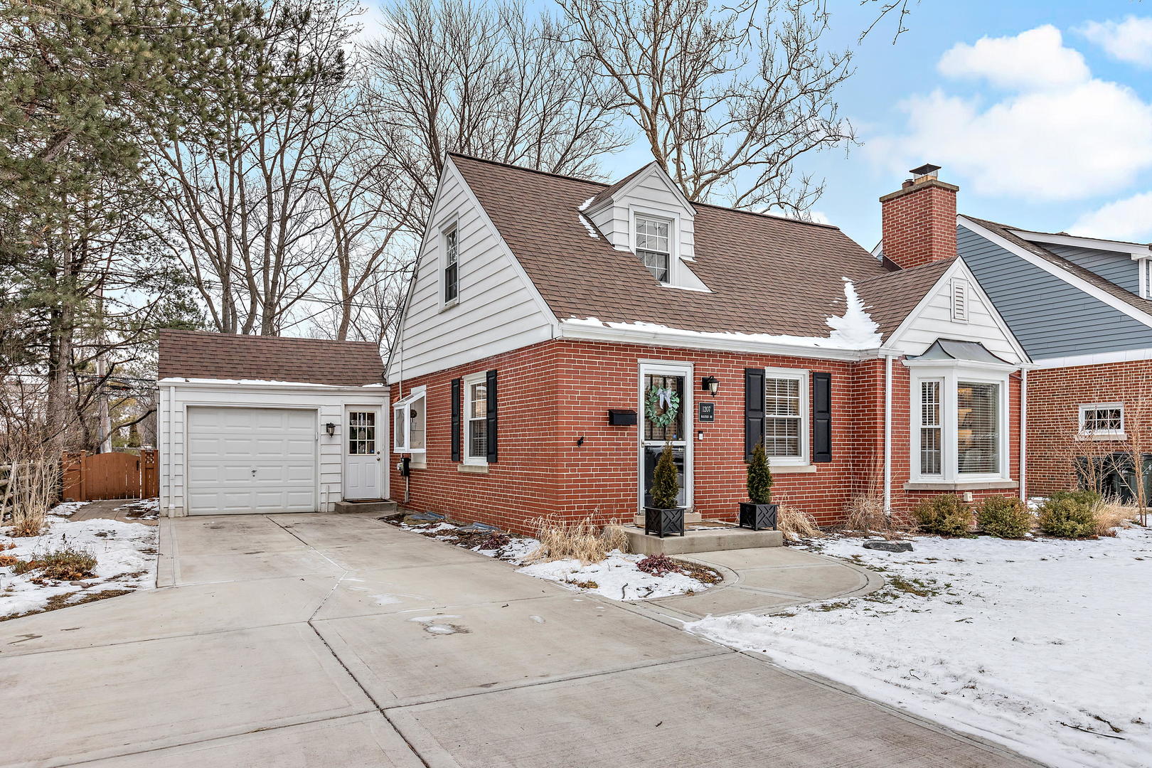 1207 Raleigh Road Glenview, IL 60025 - Photo 2 of 31 a view of a house with a yard covered in snow