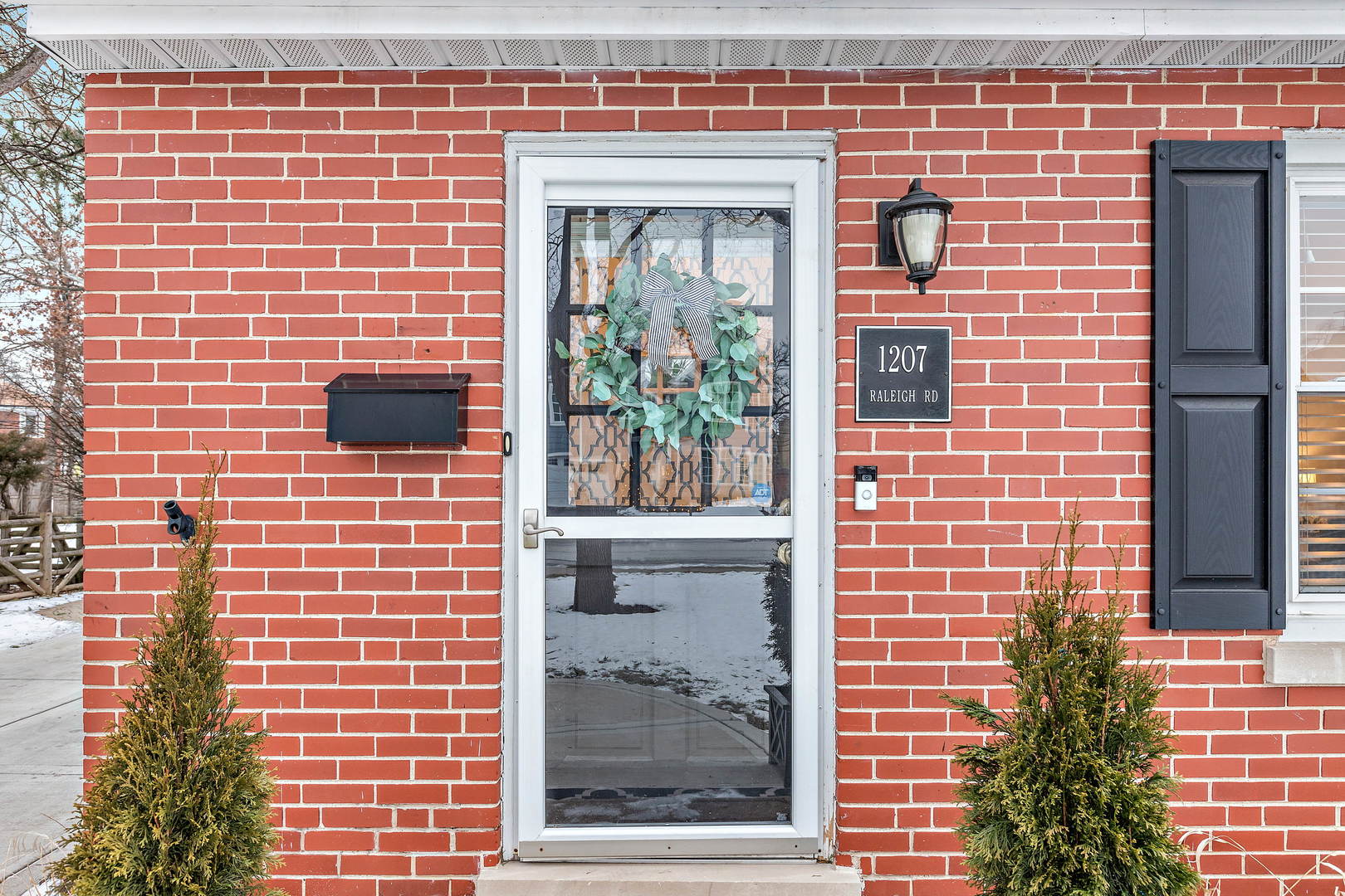 1207 Raleigh Road Glenview, IL 60025 - Photo 4 of 31 a brick building with a window and a door