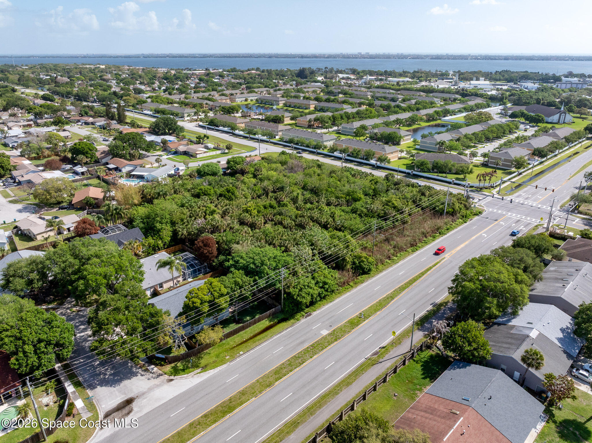 0 Lake Washington Road Melbourne, FL 32935 - Photo 3 of 14 an aerial view of residential houses with outdoor space and trees