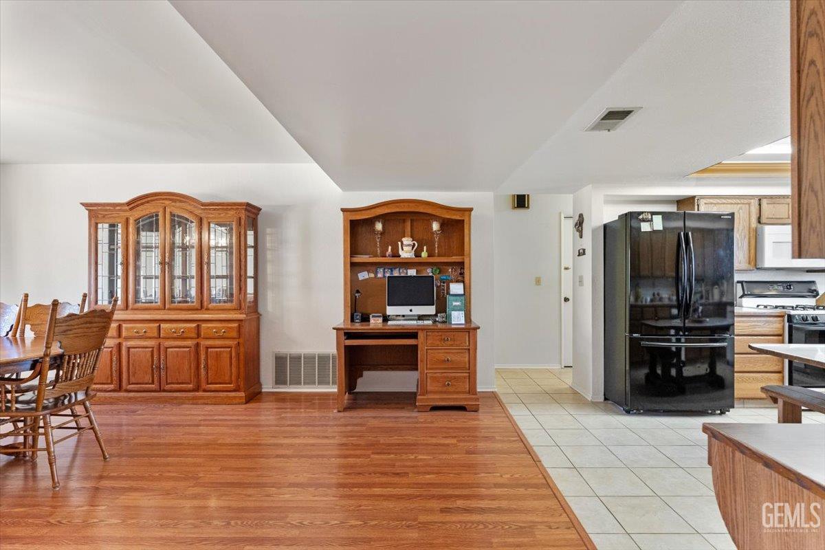 Undisclosed Address Tehachapi, CA 93561 - Photo 16 of 75 a living room with furniture and a dining table with kitchen view