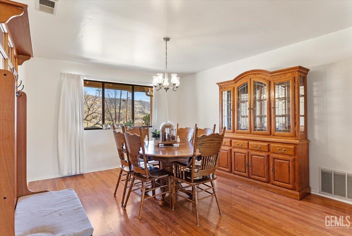 Undisclosed Address Tehachapi, CA 93561 - Photo 17 of 75 a view of a dining room with furniture window and wooden floor