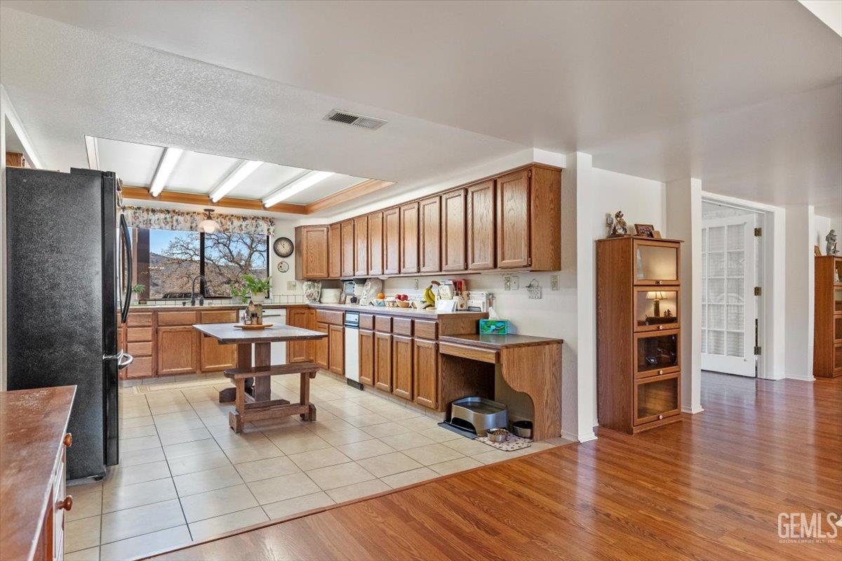 Undisclosed Address Tehachapi, CA 93561 - Photo 19 of 75 a view of kitchen with furniture and wooden floor