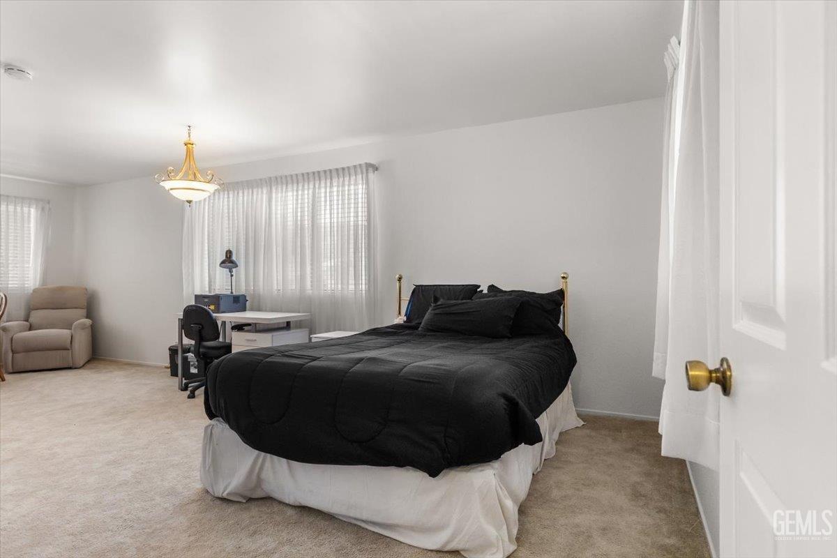 Undisclosed Address Tehachapi, CA 93561 - Photo 26 of 75 a bedroom with a bed and a couch