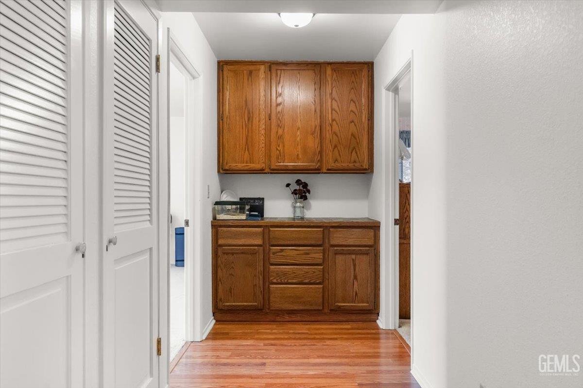 Undisclosed Address Tehachapi, CA 93561 - Photo 30 of 75 a kitchen with granite countertop white cabinets and stainless steel appliances