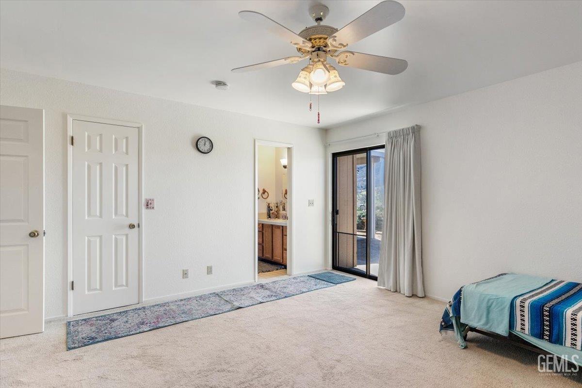 Undisclosed Address Tehachapi, CA 93561 - Photo 38 of 75 a view of a livingroom with a chandelier fan and closet area