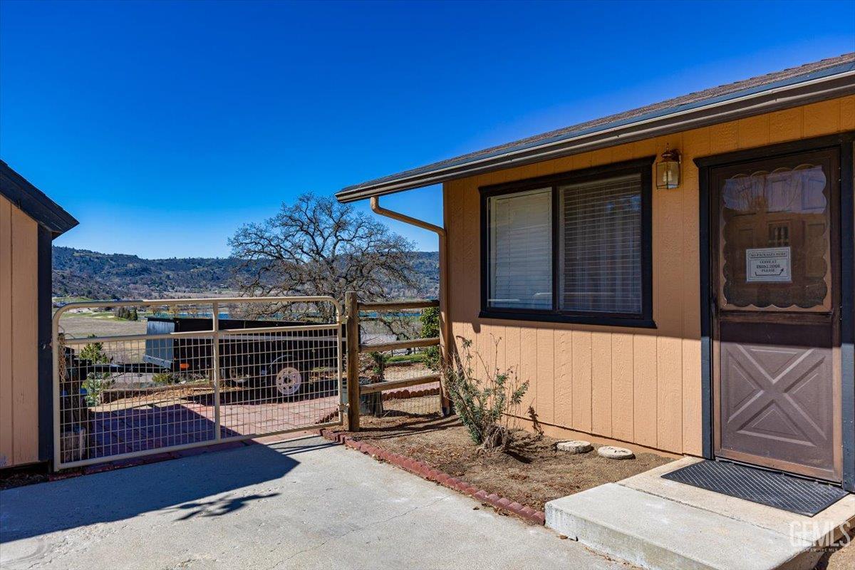 Undisclosed Address Tehachapi, CA 93561 - Photo 45 of 75 a front view of a house with a garage