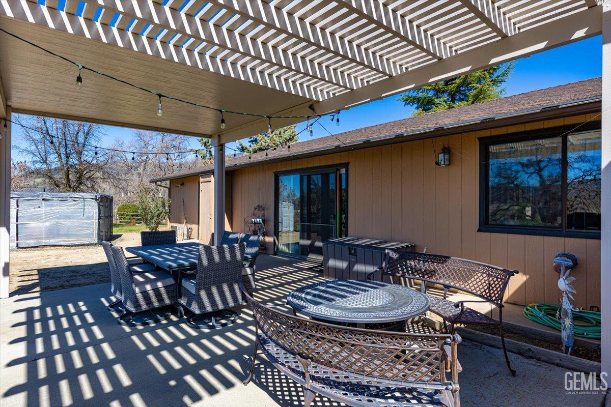 Undisclosed Address Tehachapi, CA 93561 - Photo 50 of 75 a view of a patio with table and chairs with wooden floor