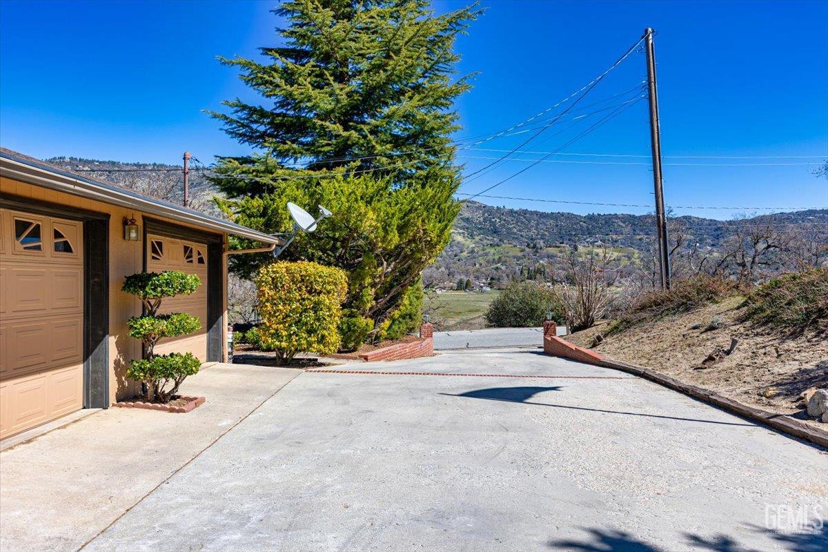 Undisclosed Address Tehachapi, CA 93561 - Photo 55 of 75 a view of a street with a tree in the background
