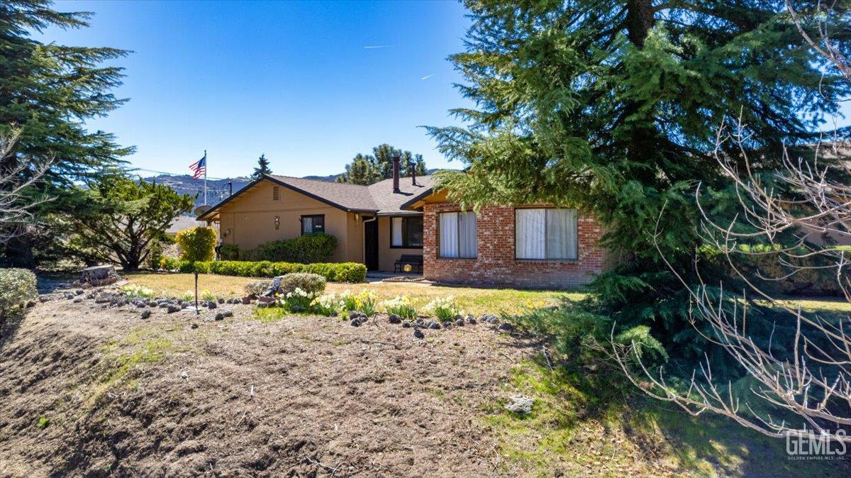 Undisclosed Address Tehachapi, CA 93561 - Photo 57 of 75 a front view of a house with a yard