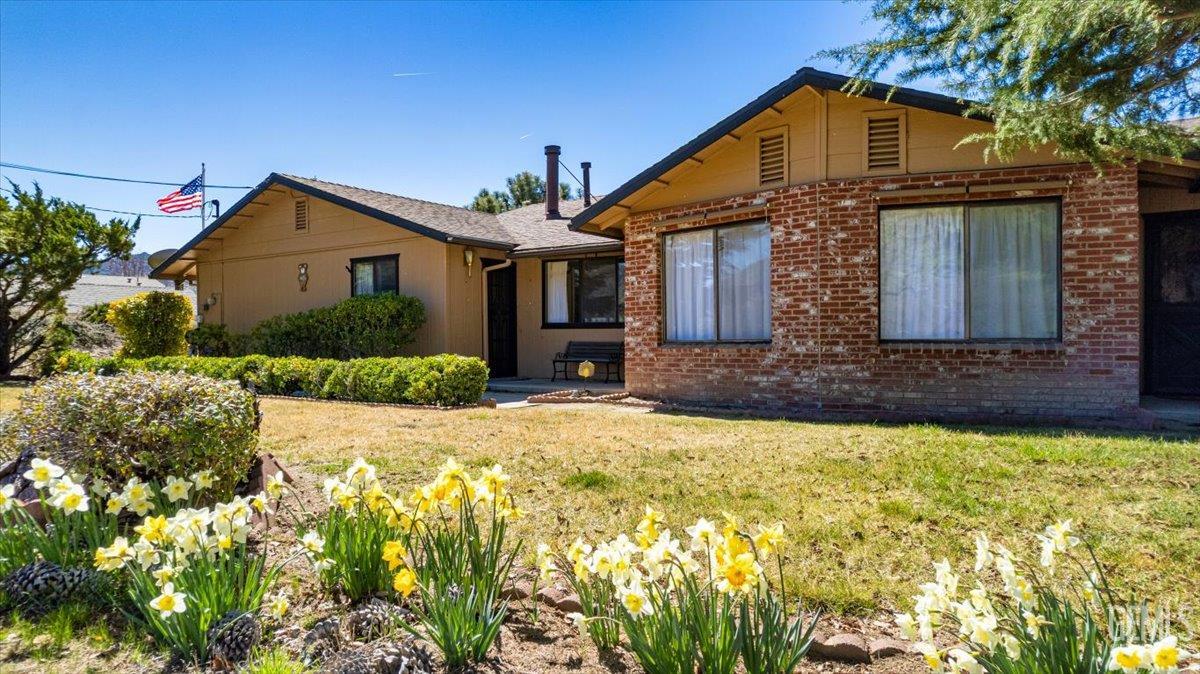 Undisclosed Address Tehachapi, CA 93561 - Photo 58 of 75 a front view of a house with a yard and garage