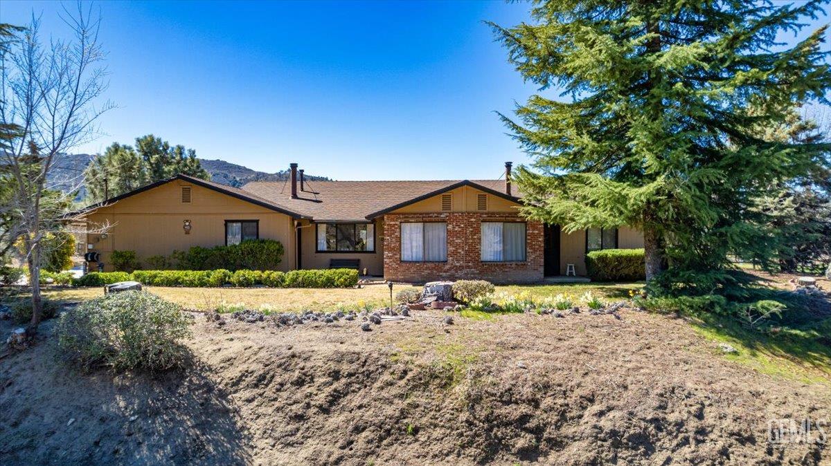 Undisclosed Address Tehachapi, CA 93561 - Photo 59 of 75 a front view of a house with a yard